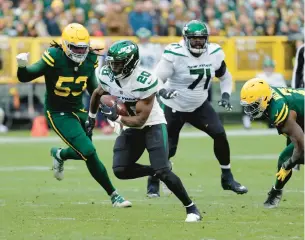  ?? MIKE ROEMER/AP ?? Jets running back Breece Hall rushes for a 34-yard touchdown in the second half Sunday against the Packers in Green Bay, Wis.