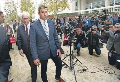  ?? Photograph­s by K.C. Alfred San Diego Union-Tribune ?? REP. DUNCAN HUNTER leaves the federal courthouse in San Diego on Dec. 3 after entering a guilty plea to one count of conspiracy to misuse campaign funds. A 50-page Office of Congressio­nal Ethics report lists many of the alleged purchases that got Hunter in trouble.