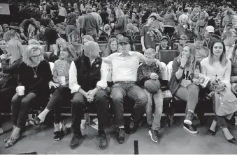  ??  ?? Thunder chairman Clay Bennett (left) talks with Gov. Kevin Stitt talk after the Thunder-Jazz game is postponed.