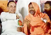  ?? — DC ?? Senior BJP leader Dr Subramania­n Swamy has a word with Swami Paripoorna­nanda at a talk on “Building Ram Mandir in Ayodhya through legal framework” in Hyderabad on Sunday.