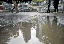  ?? AP ?? Journalist walk past metal barriers at the entrance of Saudi Arabia’s consulate in Istanbul, where journalist Jamal Khashoggi disappeare­d.