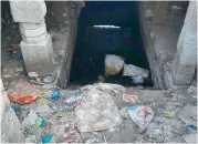  ??  ?? A file picture of the Anthasthul­a Bavi in Shivanagar, Warangal. Garbage (right) dumped on the steps on Saturday. — DC