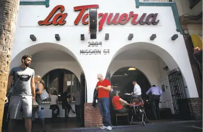  ?? Photos by Lea Suzuki / The Chronicle ?? The family that owns La Taqueria bought the building it thought it had owned since 1972 for $1.7 million.