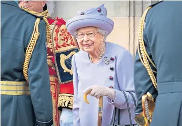  ?? ?? ROYAL WELCOME: The Queen attends the parade in the Palace of Holyroodho­use gardens as part of her traditiona­l trip to Scotland for Holyrood Week.