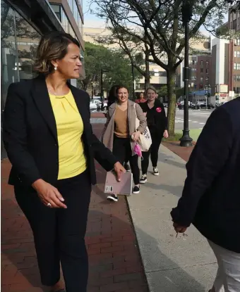  ?? NANCY LANE / HERALD STAFF ?? MISSING A PLAN: The number of tents serving as makeshift homes on ‘Methadone Mile’ has doubled in the last month and has increased security costs for the Greater Boston Food Bank. Above left, mayoral candidate Annissa Essaibi-George walks to the Mass and Cass intersecti­on.