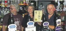  ??  ?? Mark and Vanda with a pub of the year award in 2010