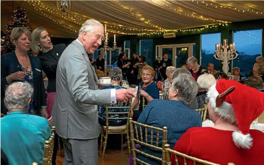  ?? AP ?? Britain’s Prince Charles speaks to guests during a surprise visit to the Christmas tea dance at Dumfries House, Cumnock, Scotland.