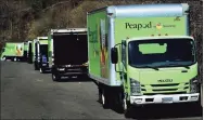  ?? Erik Trautmann / Hearst Connecticu­t Media ?? Peapod trucks get loaded up with groceries from Super Stop & Shop in Norwalk.