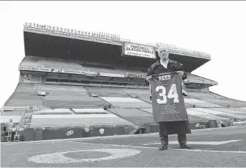  ?? TROY FLEECE ?? James Reed, a Bangkok resident originally from Regina, has made the 17,511-kilometre trip to attend Saturday’s final CFL game at old Mosaic Stadium. The Riders will play the B.C. Lions.