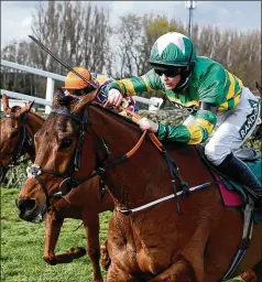  ?? PETER POWELL/POOL VIA AP ?? Rachael Blackmore rides Minella Times to victory Saturday in Britain’s grueling Grand National horse race at Aintree in Liverpool, England. Women have only been allowed to enter the National as jockeys since 1975.