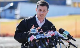  ?? Photograph: Alan Freed/Reuters ?? Transporta­tion Secretary Pete Buttigieg visits the site of the toxic train derailment in East Palestine, Ohio.