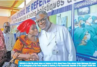  ??  ?? BUKAVU: In this file photo taken on October 6, 2018, Nobel Peace Prize winner Denis Mukwege (R) poses for a photograph at the Panzi hospital in Bukavu, in the Democratic Republic of the Congo’s South Kivu province, a day after it was announced that he will receive the prestigiou­s award. — AFP