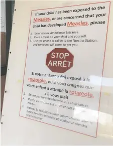  ?? ERROL MCGIHON ?? A sign from 2019 at the Children's Hospital of Eastern Ontario emergency entrance gives instructio­ns to parents on what to do if their child has been exposed or has developed measles.