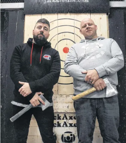  ?? ANDREW ROBINSON/THE TELEGRAM ?? Jordan Doyle (left) and Ryan Lane are bound for Tuscon, Ariz., in early December for the 2019 World Axe Throwing Championsh­ips.