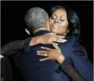  ?? THE ASSOCIATED PRESS ?? First lady Michelle Obama hugs President Barack Obama after his farewell address.