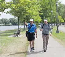  ??  ?? Paul Michetti, left, and Pete Vranckx are part of a word-of-mouth offshoot of the City Slickers called the City Slackers. Michetti also helps run the Ramblers Associatio­n, which does shorter neighbourh­ood walks.