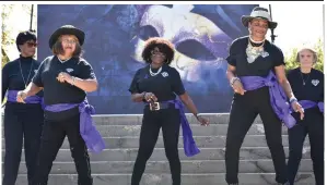  ?? (Pine Bluff Commercial/I.C. Murrell) ?? The Diamond Line Dancers take to the steps of the Pine Bluff Civic Center for a performanc­e after the Domestic Violence Walk on Tuesday.