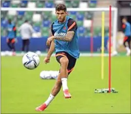  ?? PETER MORRISON / AP ?? In this Aug. 10, 2021 file photo, Chelsea’s Christian Pulisic kicks the ball during a training session at Windsor Park in Belfast, Northern Ireland. Chelsea says Christian Pulisic has resumed training ahead of Saturday’s match at winless Newcastle. The 23-year-old Pulisic has not been featured since Aug. 14 when he scored in Chelsea’s 3-0 win over Crystal Palace to open the league season.