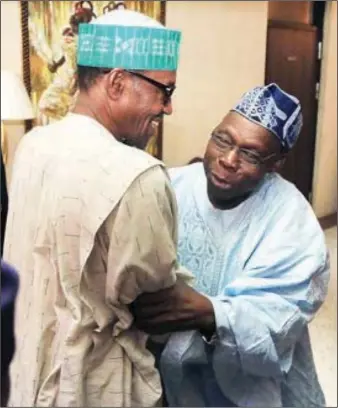  ?? Sunday Aghaeze ?? R-L: Former President, Chief Olusegun Obasanjo (right), congratula­ting the President-elect, General Muhammadu Buhari on his victory in the just concluded presidenti­al election in Lagos...Tuesday