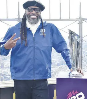  ?? (Photo: AFP) ?? Former West Indies batsman Chris Gayle poses for a photo at Empire State Building in celebratio­n of the Internatio­nal Cricket Council’s Trophy Tour in New York City on Monday.