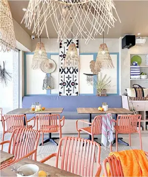  ?? ?? BRIGHTLY colored chairs and wooden lamps for that ultimate tropical vibe.