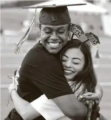  ?? Melissa Phillip / Staff photograph­er ?? Nimitz High School seniors Tyra Davis, left, and Aracely Hernandez hug at the celebratio­n at W.W. Thorne Stadium.