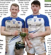  ??  ?? Kildorrery captain, Shane O’Neill, and Man of the Match Dylan Kent after last weekend’s North Cork U-21 ‘C’ Football Final win over Killavulle­n Kildorrery’s Shane O’Neill forces his way through a pair of challenges during last weekend’s North Cork U21C...