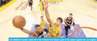  ??  ?? LOS ANGELES: Damian Lillard #0 of the Portland Trail Blazers goes to the basket against the Los Angeles Lakers on Monday at STAPLES Center in Los Angeles, California. —AFP