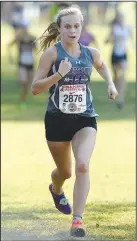  ?? NWA Democrat-Gazette/ANDY SHUPE ?? Fayettevil­le’s Grace Litzinger comes in to the finish line in the girls El Caliente. Visit nwadg. com/photos to see more photograph­s from the races.