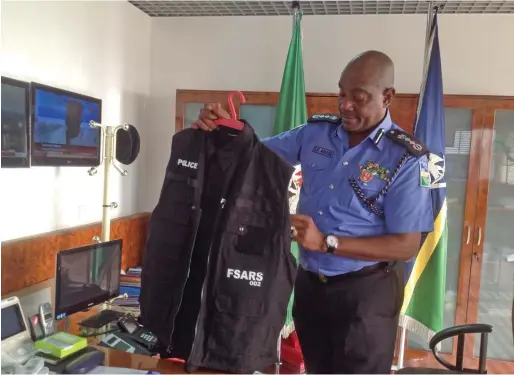  ??  ?? Inspector General of Police, Solomon Arase, displaying the re-branded FSARS uniform
