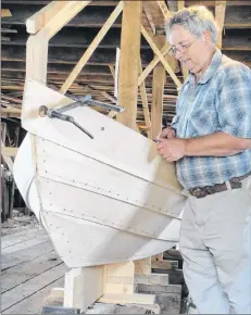  ??  ?? Master dory builder Milford Buchanan works on a dory at the Dory Shop Museum on Shelburne’s Historic Dock Street. Shelburne’s Museums by the Sea is offering a unique opportunit­y this May to anyone who would like to spend a week building a dory in the...