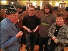  ??  ?? Bill Reid of Rock City Falls entertains questions about the Korean War from students Nathaniel Galusha, Ian Ladd and Aaron Legodais, left to right.