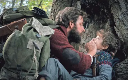  ?? PHOTOS BY JONNY COURNOYER/ PARAMOUNT STUDIOS ?? John Krasinski has to keep his family, including son Marcus (Noah Jupe), silent to keep them alive in “A Quiet Place.”