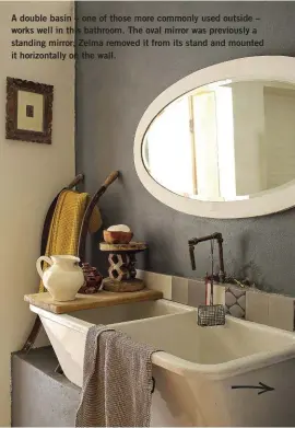  ?? ?? A double basin – one of those more commonly used outside – works well in this bathroom. The oval mirror was previously a standing mirror; Zelma removed it from its stand and mounted it horizontal­ly on the wall.