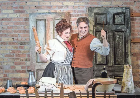  ?? MARK FROHNA ?? Christina Hall and Andrew Varela make some unusual meat pies in Skylight Music Theatre’s “Sweeney Todd.”