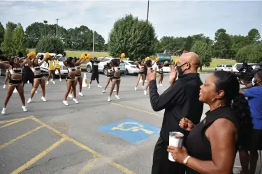  ?? (Pine Bluff Commercial/I.C. Murrell) ?? UAPB spirit squad members perform for Pearson as spirit squad Coach Karen Blunt looks on. More photos at arkansason­line.com/99pbcpears­on/.