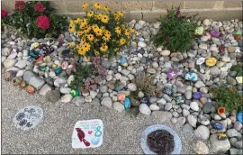  ?? COURTESY KRIS MILLER ?? People can write messages on rocks or take them home to keep.