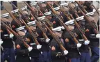  ??  ?? Marines march in President Donald Trump’s inaugural parade last year.