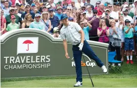  ??  ?? Jordan Spieth watches his drive from the first tee at the Travelers Championsh­ip at TPC River Highlands Wednesday in Cromwell, Conn. (AP)