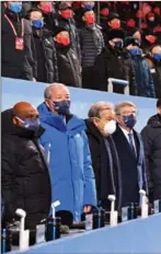  ?? ?? President Xi Jinping (fifth from left) stands along with his wife Peng Liyuan and other dignitarie­s during the opening ceremony.