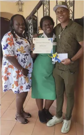  ?? ?? Kasheka Grant and her parents, Cyreta Henry and Kevin Grant revel in her second place win in the Ministry of Labour’s Child Labour Video Monologue Competitio­n.