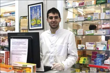  ?? THE ASSOCIATED PRESS ?? Toni Dovale poses while working in his family pharmacy March 18in A Coruna, Spain.