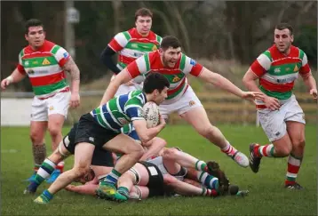  ??  ?? Stephen Horan puts his low centre of gravity to good use as he spots a gap in the Bective defensive lines.