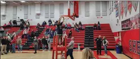  ?? David Jacobs/sdg Newspapers ?? A Toledo Central Catholic player cuts down the net after the team’s win over the Shelby Lady Whippets on Saturday night in the Division 2 northwest sectional championsh­ip game.