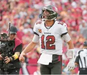  ?? PETER JONELEIT/AP ?? Buccaneers quarterbac­k Tom Brady celebrates after his rushing touchdown Sunday in Tampa, Fla.