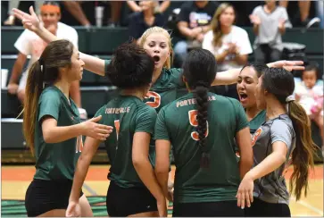  ?? RECORDER PHOTO BY CHIEKO HARA ?? Portervill­e High School’s squad celebrates after winning a point Wednesday, during the first set against Strathmore High School at Portervill­e High School.