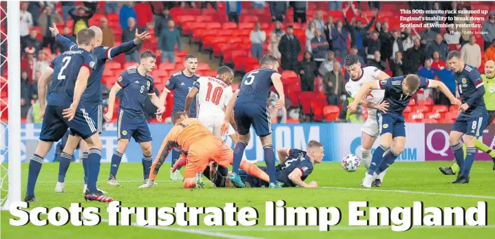  ?? Photo / Getty Images ?? This 90th-minute ruck summed up England’s inability to break down Scotland at Wembley yesterday.