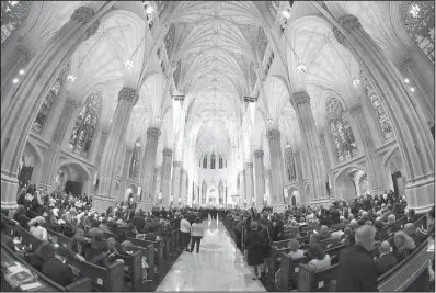  ?? AP/ROBERT SABO ?? People fill the pews in anticipati­on of Pope Francis’ arrival Thursday at St. Patrick’s Cathedral in New York, where the pope will lead an evening prayer service.