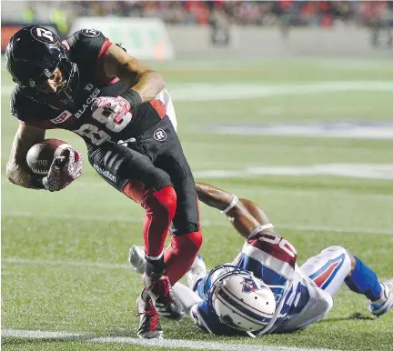  ?? SEAN KILPATRICK/THE CANADIAN PRESS ?? Redblacks wide receiver Brad Sinopoli shakes off Alouettes defensive back Tyree Hollins to score a touchdown in the third quarter Wednesday night in Ottawa’s 24-19 victory over Montreal at TD Place.