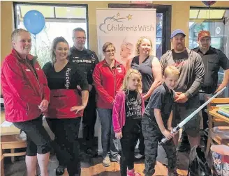  ?? Contribute­d ?? Staff from Wilson’s Go Store, Pizza Delight and members of the RCMP and Bridgewate­r Fire Department were on hand to help Ethan Trethewey (with lightsaber) and his family to celebrate his wish being granted through the Children’s Wish Foundation, Nova Scotia Chapter, to receive Jedi training. The presentati­on took place Sept. 28 at Pizza Delight in Bridgewate­r.